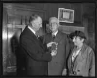 William May Garland receives the Order of the White Lion from Felix Janovsky with Madilene Veverka present, Los Angeles, 1935