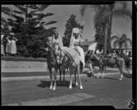 Two women in Spanish-style dress on horseback at the Old Spanish Days Fiesta, Santa Barbara, 1932