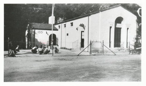 Children playing outside the schoolhouse, Topanga, California