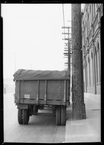 Trailer alongside pole at South Alameda Street and Factory Place & show overhang, Los Angeles, CA, 1933