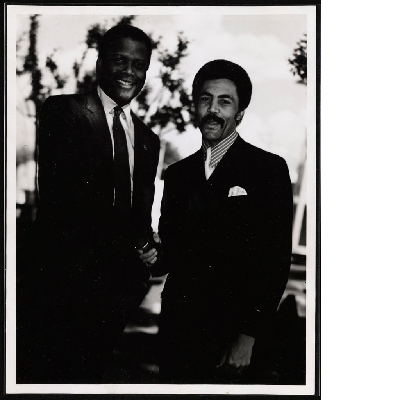 Sidney Poitier shaking hands with Ronald Dellums