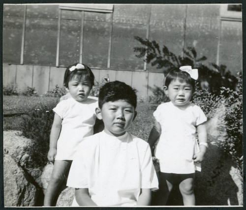Photograph of children standing in front of the Manzanar hospital