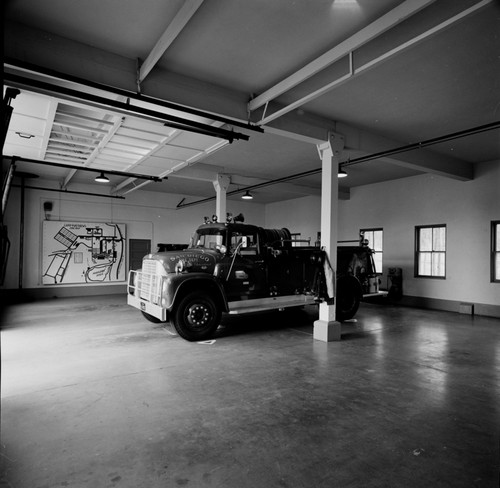 Interior view of the UCSD fire station, called Engine room 225. Originally part of Camp Matthews' marine base located at 257-E. The building was later turned over to UCSD when the Marine garrison left. Camp Matthews was a Marine garrison that was located just next to the fledgling UCSD campus. In August 1964 after 46 years of Marine training the San Diego Marine Base garrison came to an end. November 1965