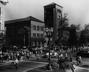 Pedestrians and automobiles crowd the streets in front of University of Southern California's (USC's) Bovard Auditorium