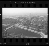 Aerial view of Elysian Park, Silver Lake Reservoir and Dodger Stadium in Los Angeles, 1987