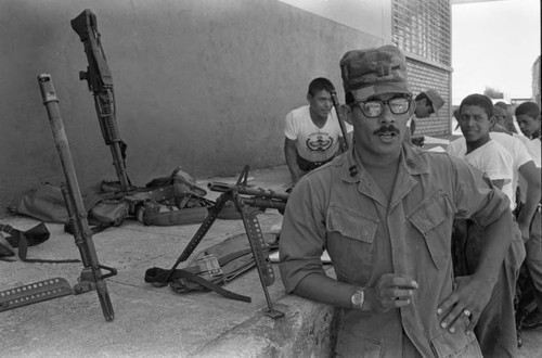 A U.S. military advisor speaks in front of a camera, Ilopango, 1983