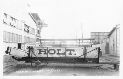 Combines (Agricultural Machinery) - Stockton: Holt Combined Harvester manufactured by Western Harvester Co., rear of header on truck