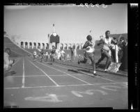 Gary Green and Clifton Ivory hit finish at Southern League 440 race at the Coliseum in Los Angeles, Calif., 1949