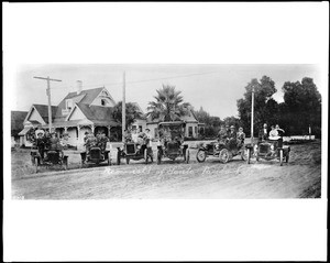 Members of Santa Paula Auto Club posing in their cars on Main Street, Santa Paula, Ventura County, ca.1905