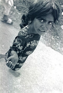 Kathmandu, Nepal, October 1991. A begging girl
