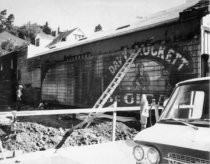 Davy Crockett Cigar ad on side of building on Throckmorton Avenue, 1966