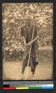 Elder chief standing outdoors, Congo, ca.1920-1940