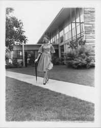 Chonne Patton, Miss Sonoma County, wearing a pumpkin silk dress from Honolulu with a velvet beret to match, Santa Rosa, California, 1959