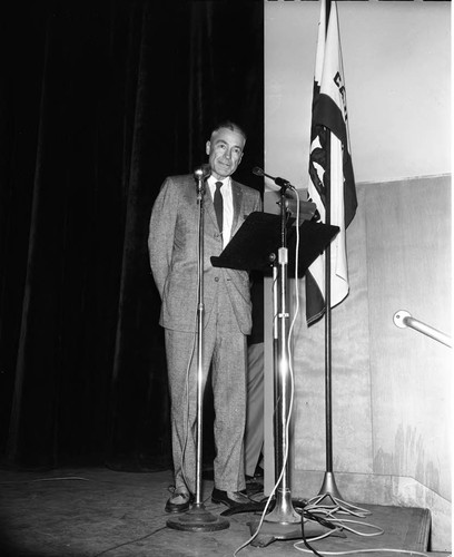 Man at podium, Los Angeles, ca. 1960
