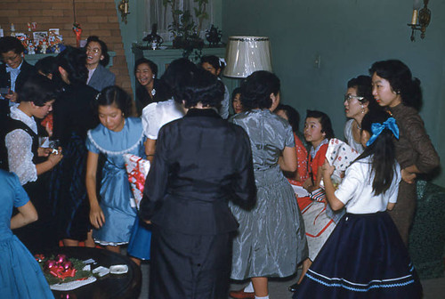 Women and girls exchanging gifts at Christmas party