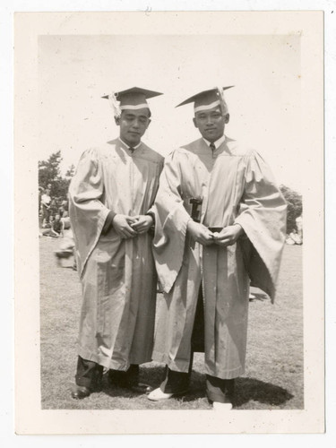 Young men in caps and gowns