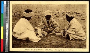 Three boys playing dominoes, Wargla, Algeria, ca.1920-1940