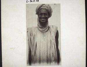 A mohammedan trader with pointed nose, from the interior of Cameroon; in the courtyard of the Mission store in Bonaku