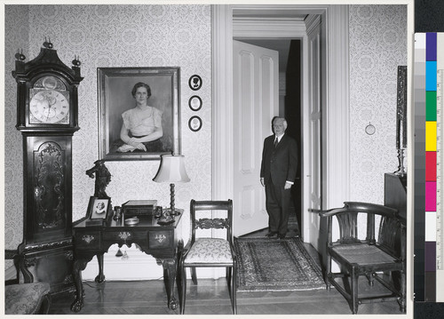 [Home interior with man standing in doorway.]