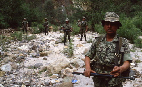 Soldiers in montanoius terrain search of guerillas, Zaragoza, 1982