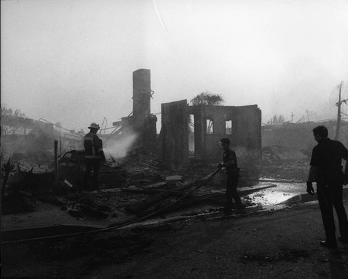 Firefighters at a destroyed home, Los Angeles, ca. 1974