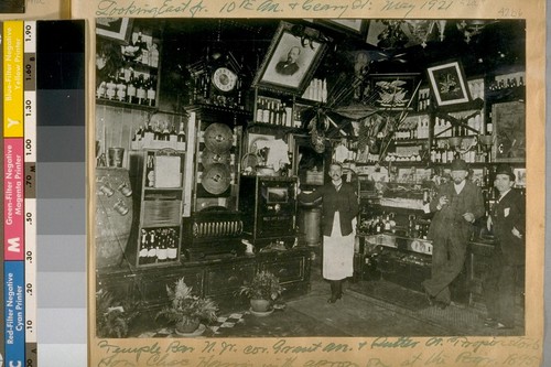 Temple Bar N.W. cor. Grant Ave. & Sutter St. Proprietor's son, Chas. Harris with apron on at the Bar, 1895