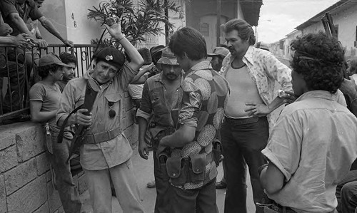 Sandinistas gather outside of a building, Nicaragua, 1979