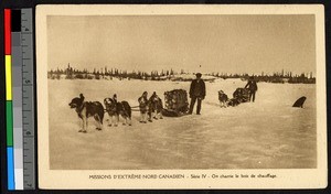 Men guiding dog sleds over a snowy plain, Canada, ca.1920-1940