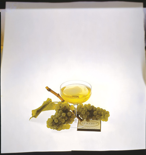 Champagne glass with grapes and Almaden label
