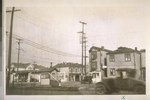 The S. E. corner 7th and West St. Oakland. The square house on the right was part of the 1st School building in Oakland. Photo taken Sept. 26/28