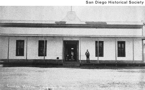 Man standing on the porch in of the Mexican customhouse in Tijuana, Mexico