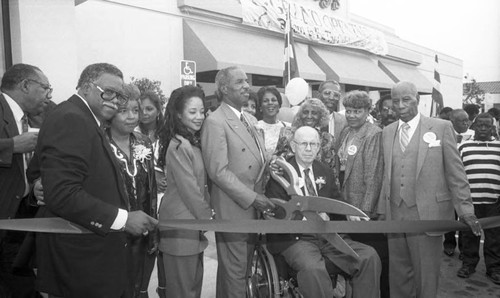 Donald Bohana and Kenneth Hahn cutting the ribbon at a restaurant opening, Los Angeles, 1992
