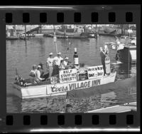 Boat in the Sculling and Punting Society parade along Balboa Island, Calif., 1965
