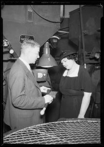 Mrs. Rogers and Mr. Weaver in coffee roasting room, Southern California, 1935