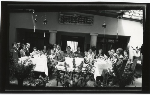 Family banquet in interior courtyard of Fletcher home at 4th and Walnut Avenue, San Diego