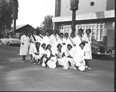 Group photograph of members of the Order of the Eastern Star standing in front of Orange Valley Lodge #13