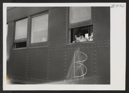Boy accompanying his parents to the Tule Lake Center looks out a window of the special train which carried 254 transferees from the Minidoka Relocation Center. Hunt, Idaho