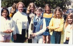 Gravenstein School band teacher with members of band accepting trophy award after Apple Blossom Parade, about 1980