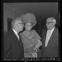 Morris Lavine with attorneys George A. Forde, Gladys Towles Root during arraignment on unethical conduct in Los Angeles, Calif., 1964