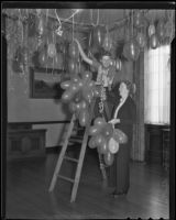 Anna Butts and Norma Crowell in charge of decorations at the Ebell Club for New Year's Eve, Los Angeles, 1935