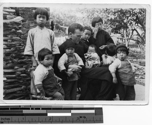 Fr. Thomas A. O'Neill and children at Jiangmen, China, 1935