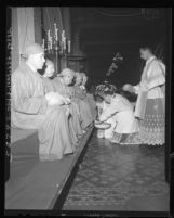 Father Fidel Zapatero conducting washing of the feet on Holy Thursday in Los Angeles, Calif., 1948