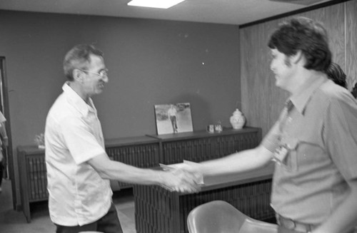U.S. Ambassador shakes hands with Junta member, Managua, 1980
