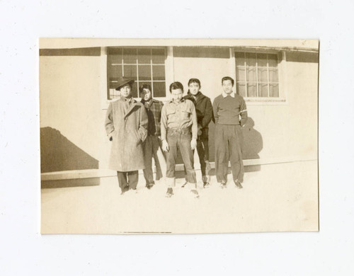 James Osamu Saito with a small group of young men