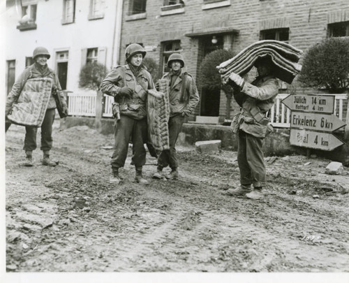 Research photo: US soldiers collect mattresses in a German town, 1945