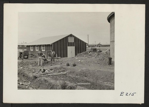 Evacuee workers are here constructing water facilities for use at the Jerome Relocation Center. Photographer: Parker, Tom Denson, Arkansas