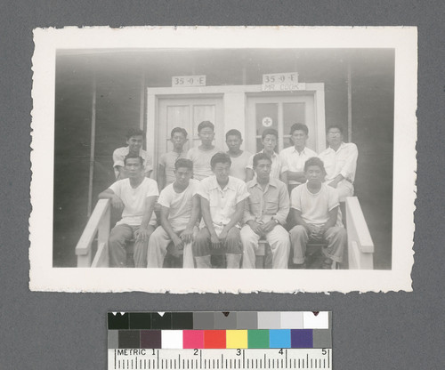 Groups of men #5 [two rows, seated on porch; same group as #63]