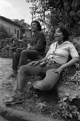 Sandinistas on a curb, Nicaragua, 1979