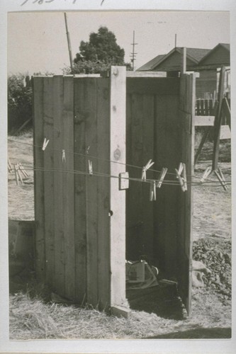 Typical privies - scores of them have been hurriedly erected - that serve Richmond Shipyard workers. Other families, living within a block or two of brush-lined Richmond "creeks" that are dry at this time of year, use the gravelled creek beds as latrines. After heavy rains, these lowlands overflow