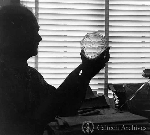 Linus Pauling holding a crystal model